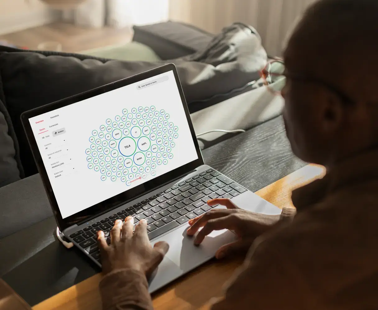 Market Buzz tool on Deriv.com, exploring company trends with a visual cluster on a laptop.