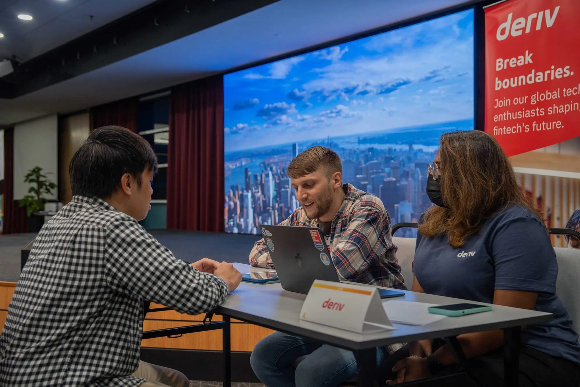A HackerX participant connecting with Deriv tech and recruitment professionals at Deriv HQ, Malaysia