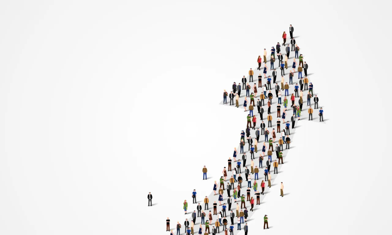 一群人形成一个向上的箭头，象征着增长、团队合作和集体进步。