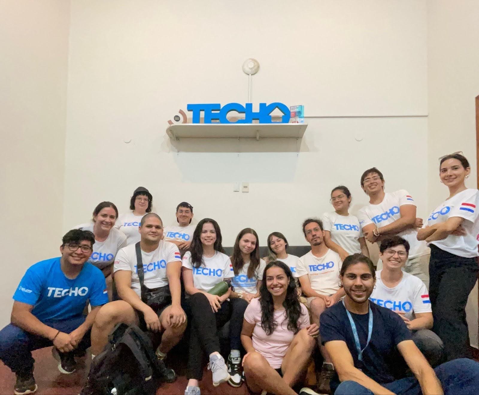 Deriv Asunción employees in the TECHO office.