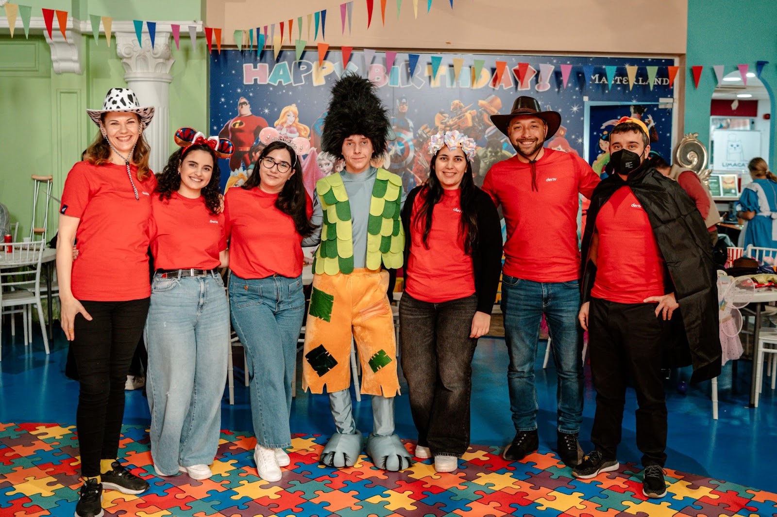 Deriv team on different costumes for kids to enjoy at One Dream, One Wish Cyprus hosting a carnival event for kids